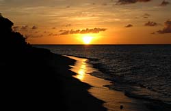 Sunset reflected in the wet sand